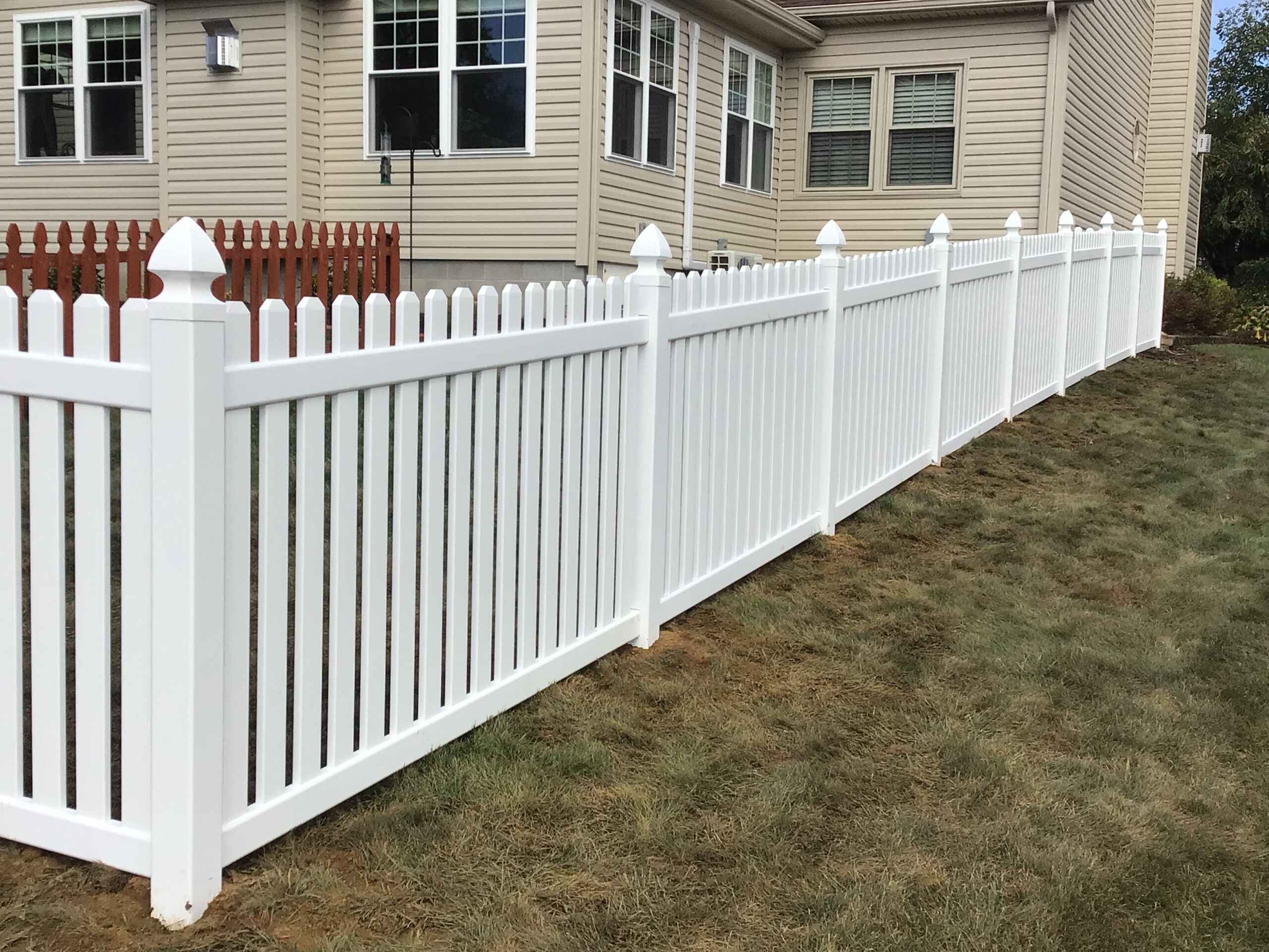 Vinyl Picket Fence, installed by Swiss Valley Fence. Barberton Ohio