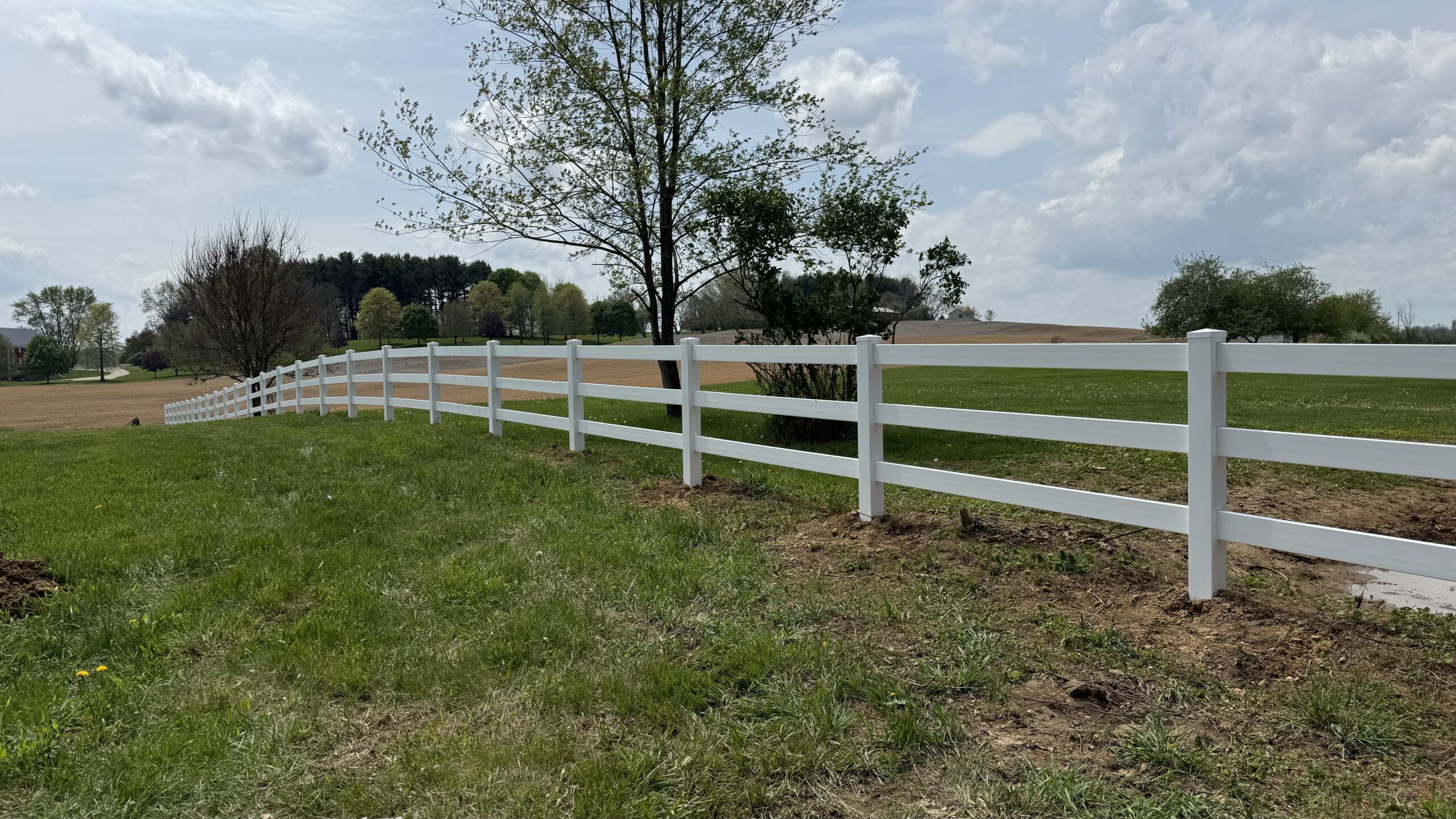 Vinyl Rail Fence, installed by Swiss Valley Fence. Chandlersville Ohio.